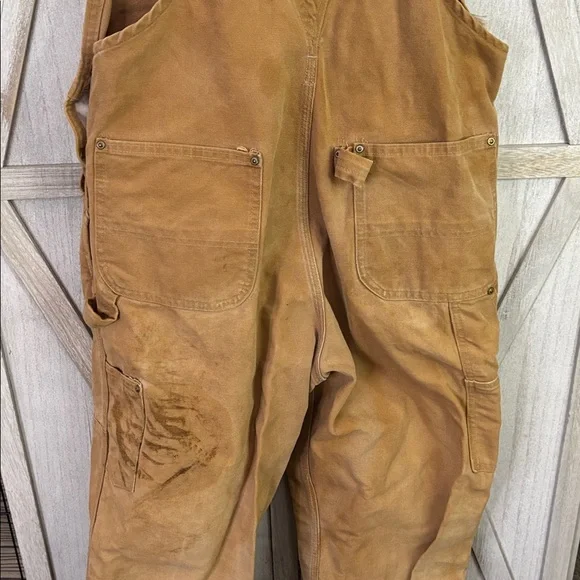 Thrashed vintage 80s or 90s carhartt unlined beige double knee duck overall bibs